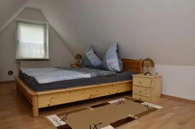 Ein Bett oder Betten in einem Zimmer der Unterkunft Förster Stolpmünder Weg