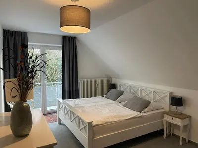 Ein Bett oder Betten in einem Zimmer der Unterkunft Wasserblick Stadtidyll 3 Zimmer Apartment Lübeck