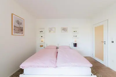 Ein Bett oder Betten in einem Zimmer der Unterkunft Ferienwohnung cozy - Scharbeutz