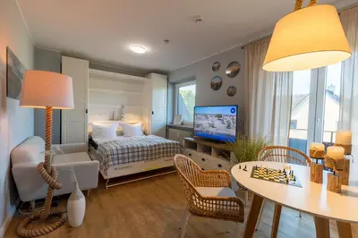 Ein Bett oder Betten in einem Zimmer der Unterkunft Maritime Wohnung Ostsee mit privatem Seezugang