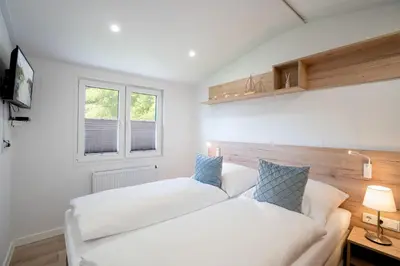 Ein Bett oder Betten in einem Zimmer der Unterkunft Ostseecamp Lübecker Bucht Ferienhaus 