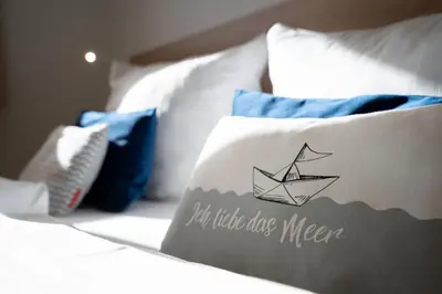 Ein Bett oder Betten in einem Zimmer der Unterkunft Ostseecamp Lübecker Bucht Haus 