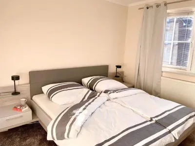 Ein Bett oder Betten in einem Zimmer der Unterkunft Turmresidenz 6 KaMare - 300m zum Strand