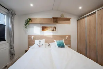Ein Bett oder Betten in einem Zimmer der Unterkunft Ostseecamp Lübecker Bucht Ferienhaus 