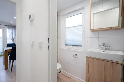 Ein Badezimmer in der Unterkunft Ostseecamp Lübecker Bucht Ferienhaus 