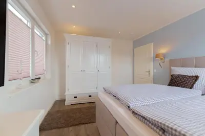 Ein Bett oder Betten in einem Zimmer der Unterkunft Ferienwohnung Aalkate App 2