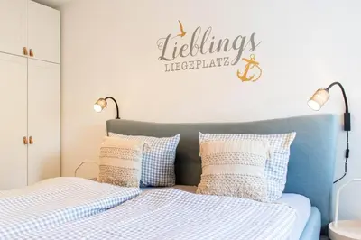 Ein Bett oder Betten in einem Zimmer der Unterkunft Ferienwohnung Die Hanse 12