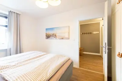 Ein Bett oder Betten in einem Zimmer der Unterkunft Ferienwohnung Die Hanse 12