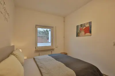 Ein Bett oder Betten in einem Zimmer der Unterkunft Hannas Strandhaus App B