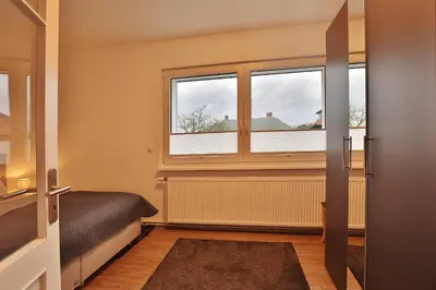 Ein Bett oder Betten in einem Zimmer der Unterkunft Hannas Strandhaus App C