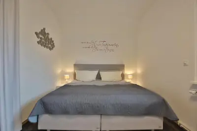 Ein Bett oder Betten in einem Zimmer der Unterkunft Hannas Strandhaus App C