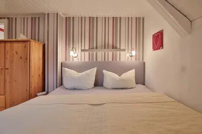 Ein Bett oder Betten in einem Zimmer der Unterkunft Hannas Strandhaus Hannas Strandhaus App D