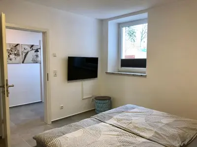 TV/Unterhaltungsangebot in der Unterkunft Erdgeschoss-Appartement mit Seeterasse