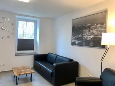 Ein Sitzbereich in der Unterkunft Erdgeschoss-Appartement mit Seeterasse