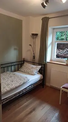 Ein Bett oder Betten in einem Zimmer der Unterkunft FeWo mit Heimatgefühl