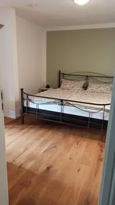 Ein Bett oder Betten in einem Zimmer der Unterkunft FeWo mit Heimatgefühl