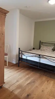 Ein Bett oder Betten in einem Zimmer der Unterkunft FeWo mit Heimatgefühl