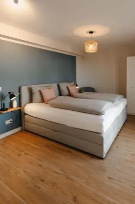 Ein Bett oder Betten in einem Zimmer der Unterkunft Utkiek Stuuv