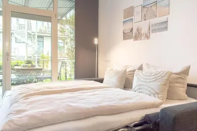 Ein Bett oder Betten in einem Zimmer der Unterkunft Ferienwohnung 54 Grad Nord App 8