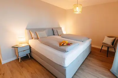 Ein Bett oder Betten in einem Zimmer der Unterkunft Frünn Stuuv