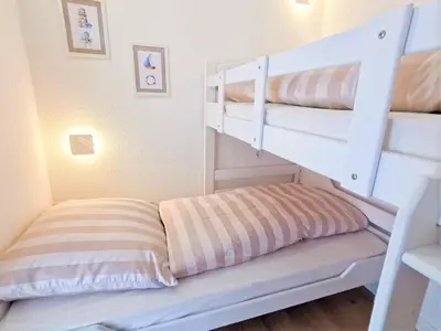 Ein Bett oder Betten in einem Zimmer der Unterkunft Ferienpark Sierksdorf App 193 - Strandlage Strandkorb