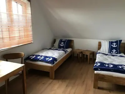 Ein Bett oder Betten in einem Zimmer der Unterkunft Neu! Strandnah XXL bis 12 Pers2Kinder Haus AB