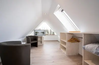 Ein Bett oder Betten in einem Zimmer der Unterkunft Haus Strandwinkel Ferienwohnung 