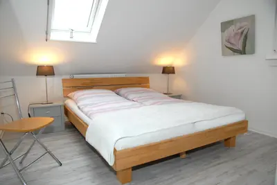 Ein Bett oder Betten in einem Zimmer der Unterkunft Seeschwalbe