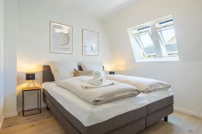 Ein Bett oder Betten in einem Zimmer der Unterkunft Villa Dornkamp 3