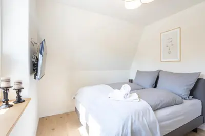 Ein Bett oder Betten in einem Zimmer der Unterkunft Villa Dornkamp 3