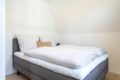 Ein Bett oder Betten in einem Zimmer der Unterkunft Villa Dornkamp 4