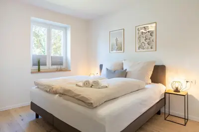 Ein Bett oder Betten in einem Zimmer der Unterkunft Villa Dornkamp 2