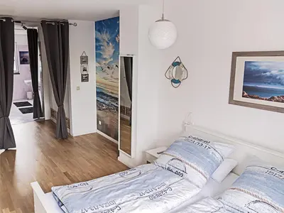 Ein Bett oder Betten in einem Zimmer der Unterkunft Unsere-Insel-Scharbeutz