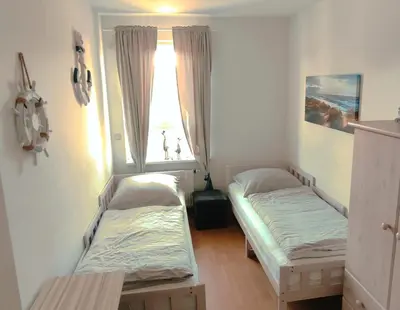Ein Bett oder Betten in einem Zimmer der Unterkunft Unsere-Insel-Scharbeutz