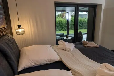 Ein Bett oder Betten in einem Zimmer der Unterkunft Wellness House Oase Spa mit Whirlpool