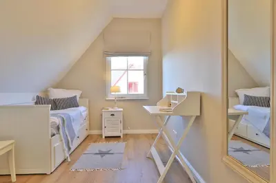 Ein Bett oder Betten in einem Zimmer der Unterkunft Das Reethaus