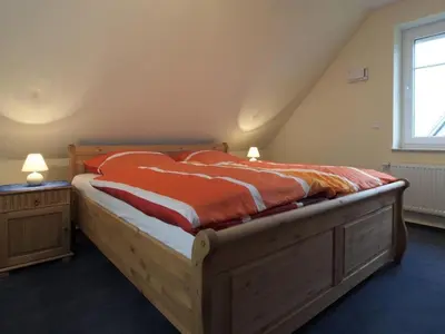 Ein Bett oder Betten in einem Zimmer der Unterkunft Schneckenhaus Ferienhaus