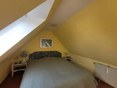 Ein Bett oder Betten in einem Zimmer der Unterkunft Rosenperle de - FeWo in Timmendorfer Strand