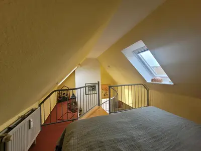 Ein Bett oder Betten in einem Zimmer der Unterkunft Rosenperle de - FeWo in Timmendorfer Strand