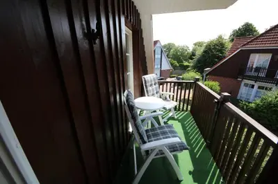 Ein Balkon oder eine Terrasse in der Unterkunft Rosenperle de - FeWo in Timmendorfer Strand