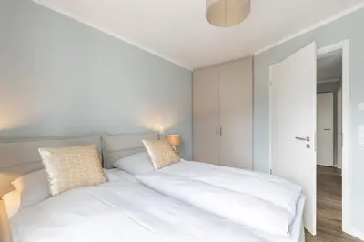 Ein Bett oder Betten in einem Zimmer der Unterkunft Sturmfrei Suite 1