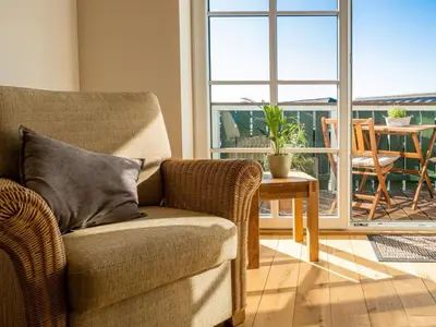 Ein Sitzbereich in der Unterkunft Ferienwohnung Meer und Muh
