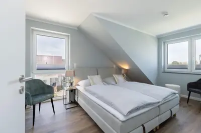 Ein Bett oder Betten in einem Zimmer der Unterkunft Sturmfrei Galerie 3